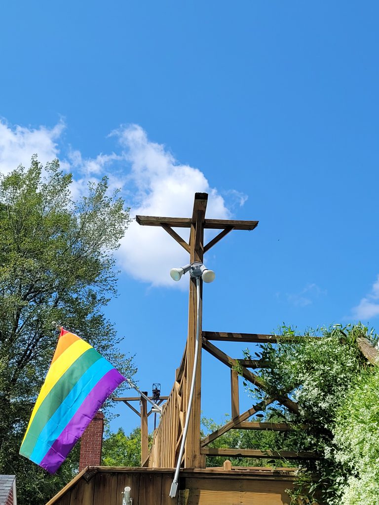 Blue sky with a rainbow flag